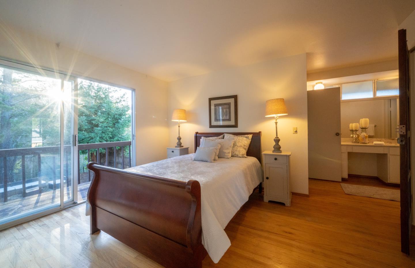 935 Park Pacifica Avenue Pacifica, CA 94044 - Photo 21 of 44 a bedroom with a bed a lamp and window