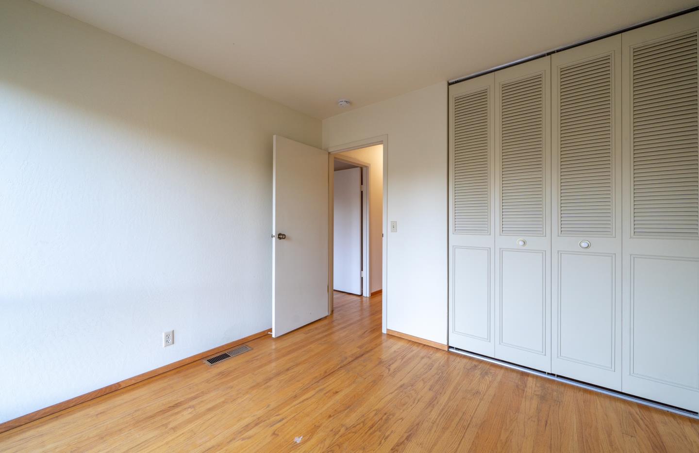 935 Park Pacifica Avenue Pacifica, CA 94044 - Photo 30 of 44 wooden floor in an empty room