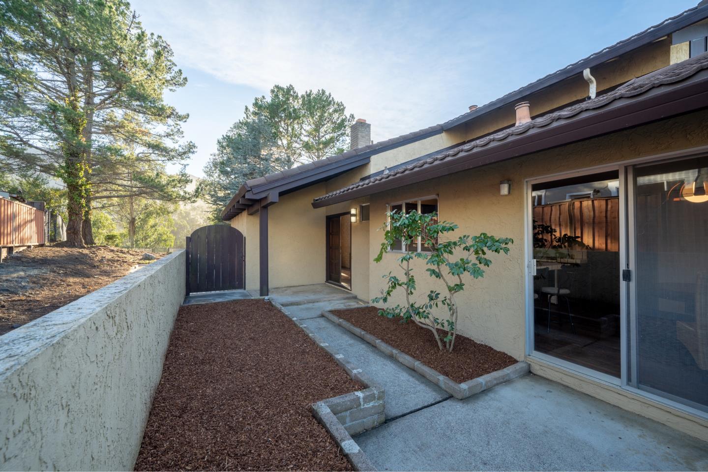 935 Park Pacifica Avenue Pacifica, CA 94044 - Photo 3 of 44 a view of a house with potted plants