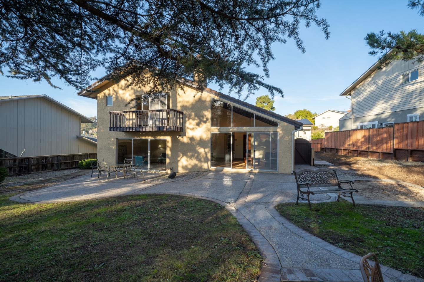 935 Park Pacifica Avenue Pacifica, CA 94044 - Photo 33 of 44 a front view of a house with a garden and patio