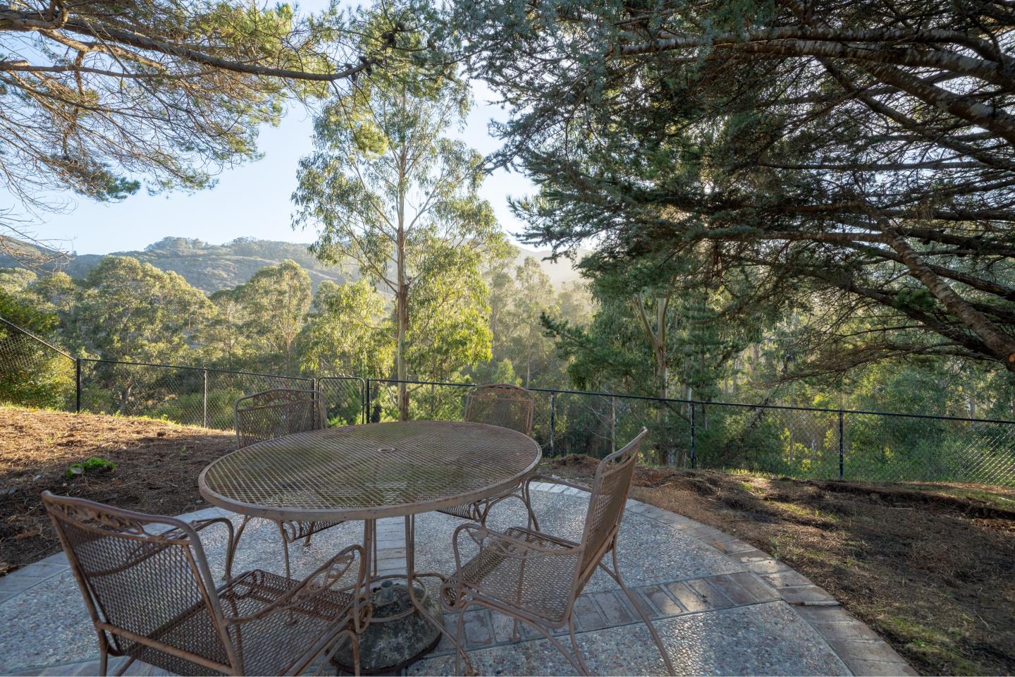 935 Park Pacifica Avenue Pacifica, CA 94044 - Photo 35 of 44 a view of a balcony with a table and chairs