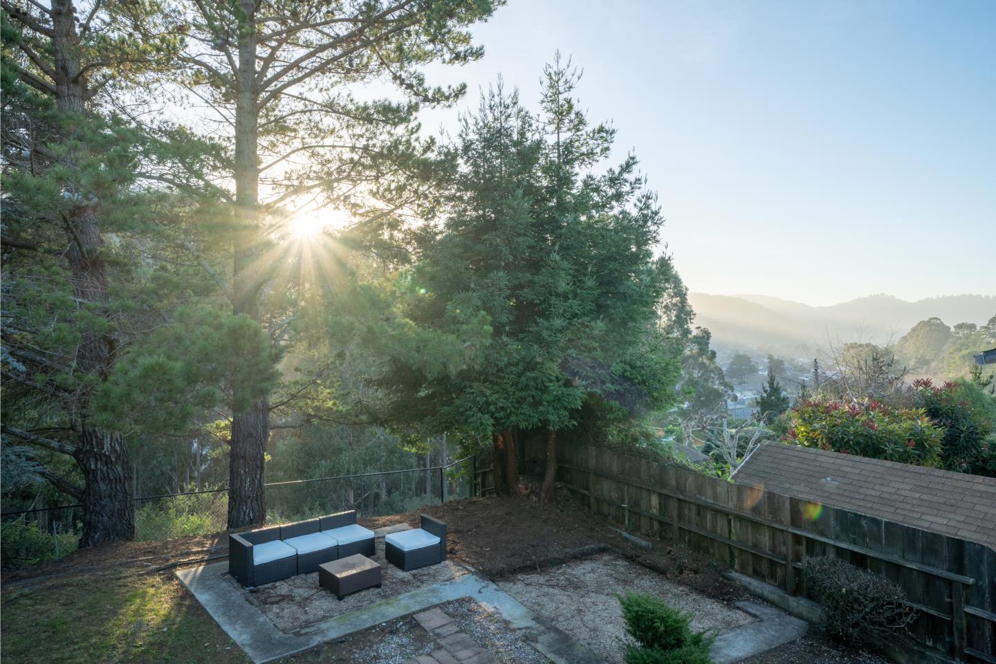 935 Park Pacifica Avenue Pacifica, CA 94044 - Photo 38 of 44 a view of a backyard with plants and trees