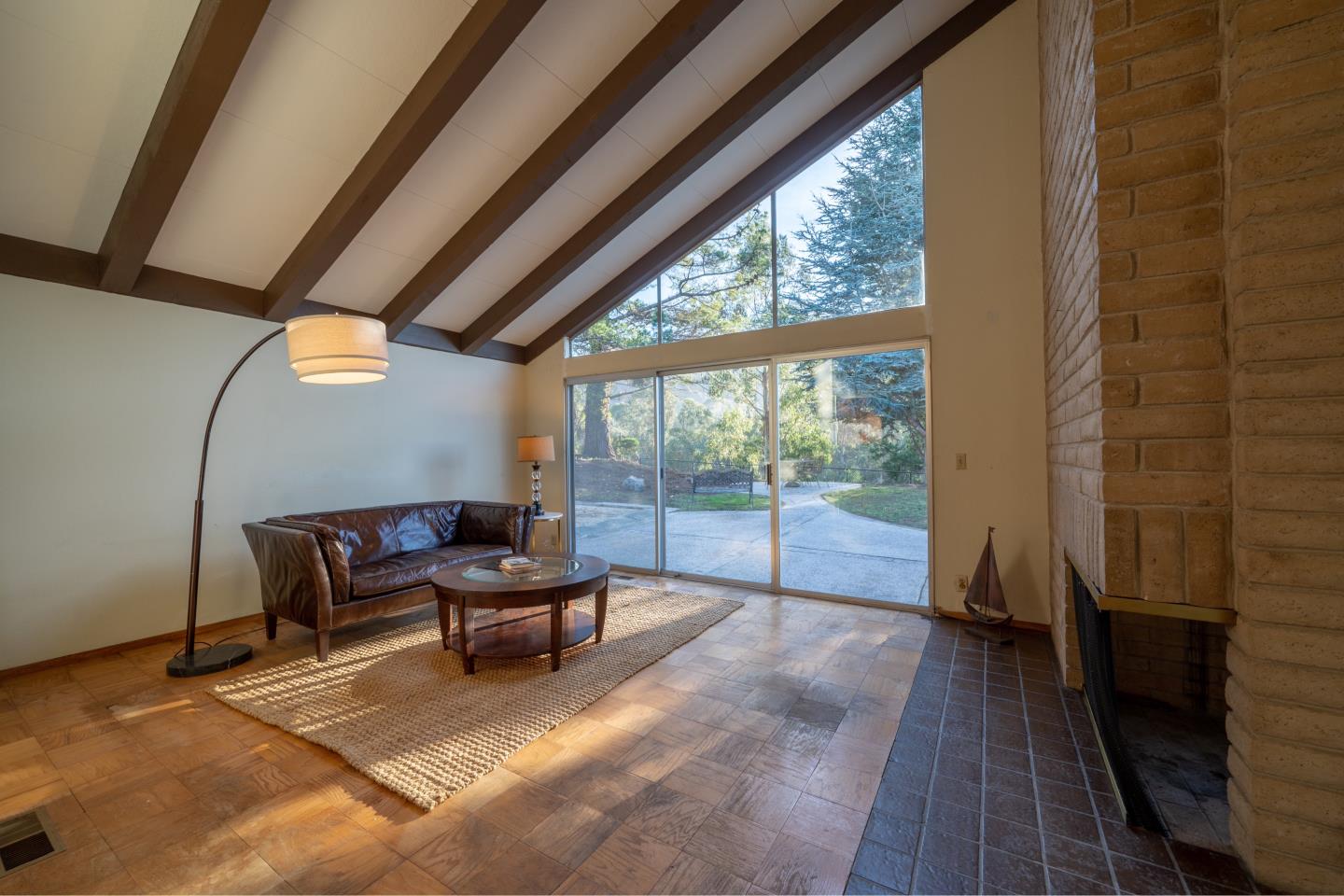 935 Park Pacifica Avenue Pacifica, CA 94044 - Photo 6 of 44 a living room with furniture and a floor to ceiling window
