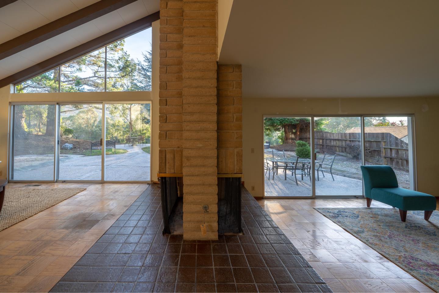 935 Park Pacifica Avenue Pacifica, CA 94044 - Photo 9 of 44 a living room with furniture and a floor to ceiling window