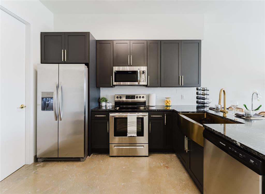 2750 Griffin Road, Unit 412 Fort Lauderdale, FL 33312 - Photo 6 of 47 a kitchen with a refrigerator and a stove top oven