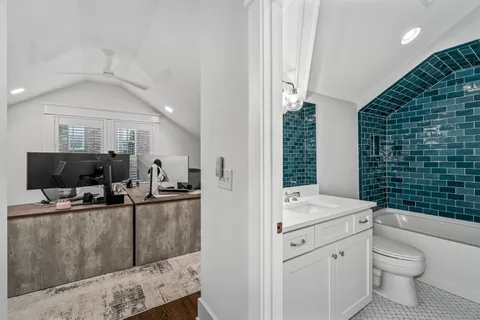 a bathroom with a toilet sink and shower