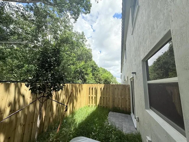 a backyard of a house with a garden