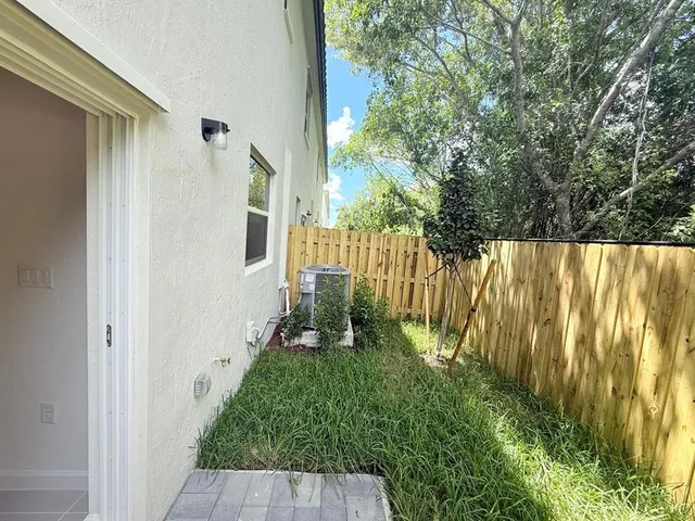 a backyard of a house with lots of green space
