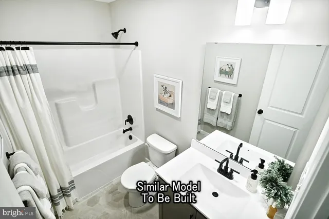 a bathroom with a bathtub sink and mirror