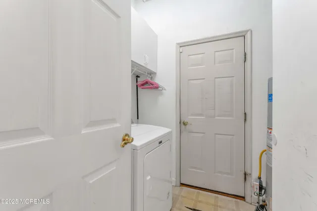 a bathroom with a sink toilet and a mirror