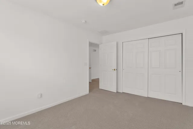 a bathroom with a sink toilet vanity and shower
