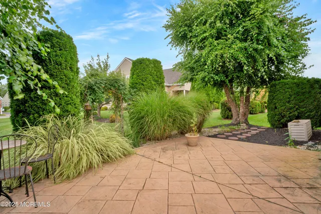 an aerial view of a house with a garden and a yard