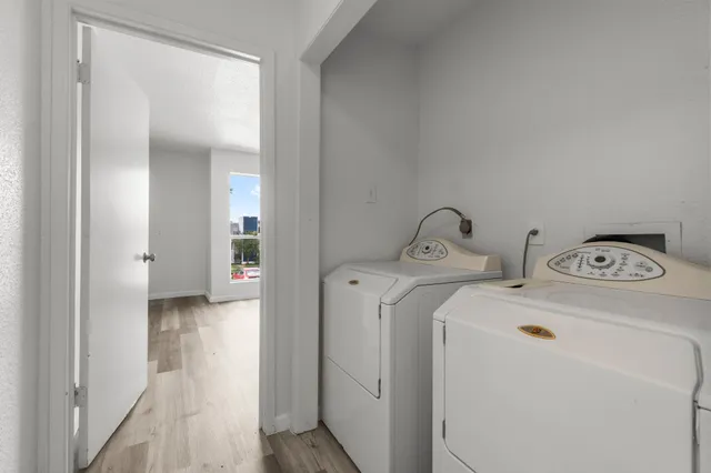 a view of a door and wooden floor