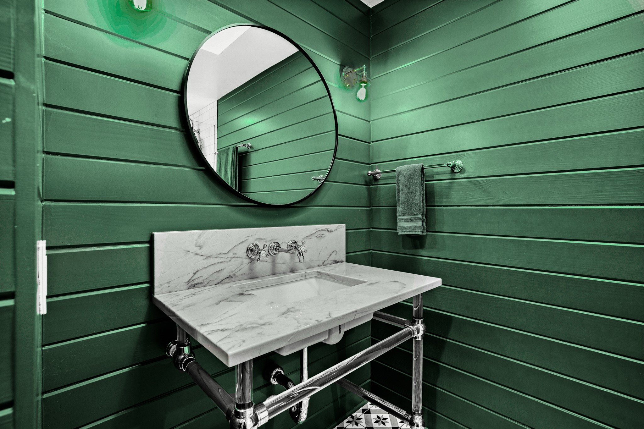 1601 Whitney Way Austin, TX 78741 - Photo 12 of 30 Marble vanity and polished chrome fixtures enhance this vibrant bathroom.