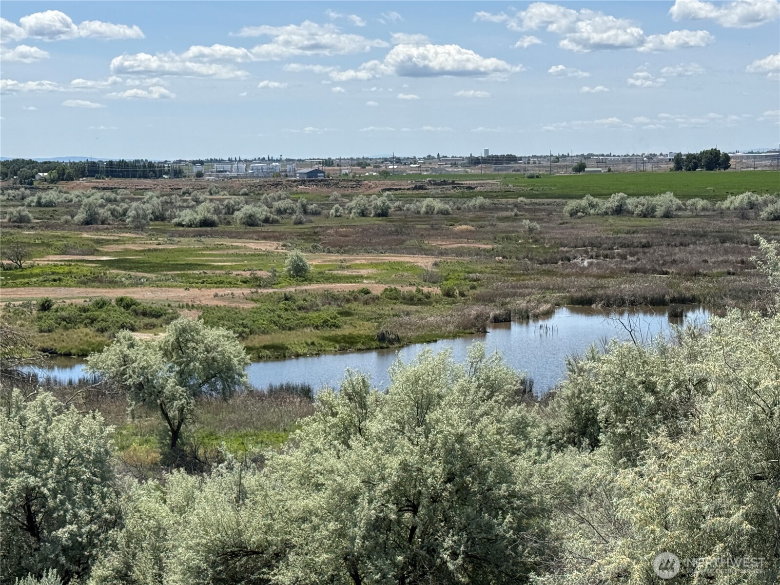 8708 Rd K Northeast Moses Lake, WA 98837 - Photo 27 of 40 a view of a lake with a big yard