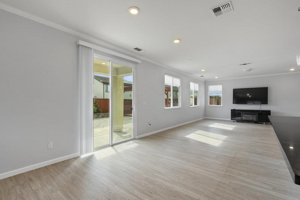 638 Summerfield Drive Soledad, CA 93960 - Photo 23 of 50 a view of an empty room with a window and a kitchen
