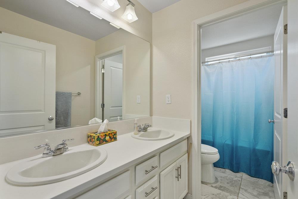 638 Summerfield Drive Soledad, CA 93960 - Photo 28 of 50 a bathroom with a sink and a mirror