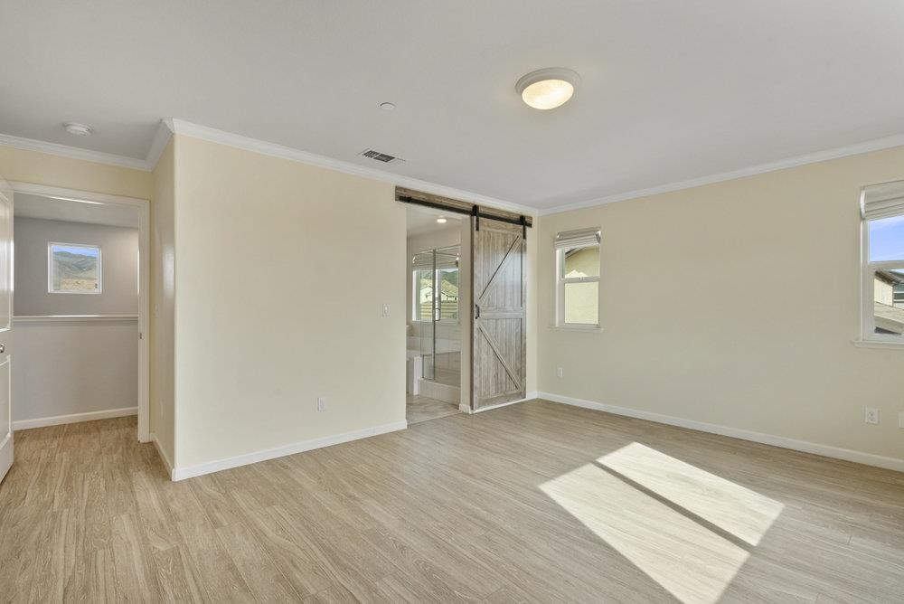 638 Summerfield Drive Soledad, CA 93960 - Photo 30 of 50 an empty room with wooden floor and windows