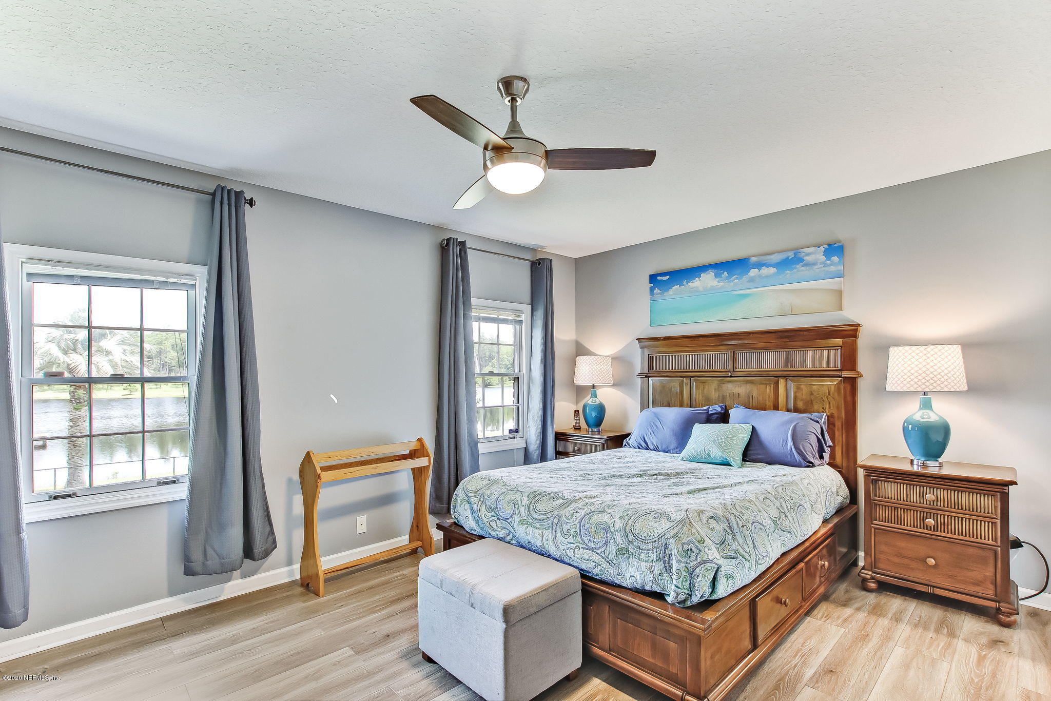 18261 Antler Road Hilliard, FL 32046 - Photo 16 of 32 a bedroom with a large bed and a window