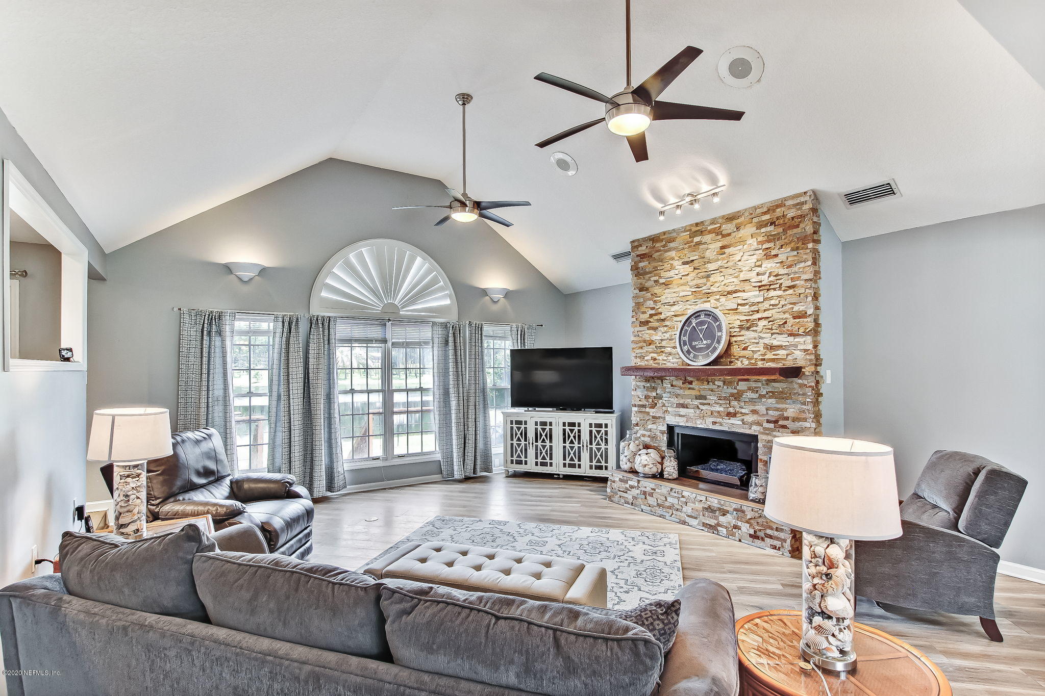 18261 Antler Road Hilliard, FL 32046 - Photo 3 of 32 a living room with furniture fireplace and a fireplace