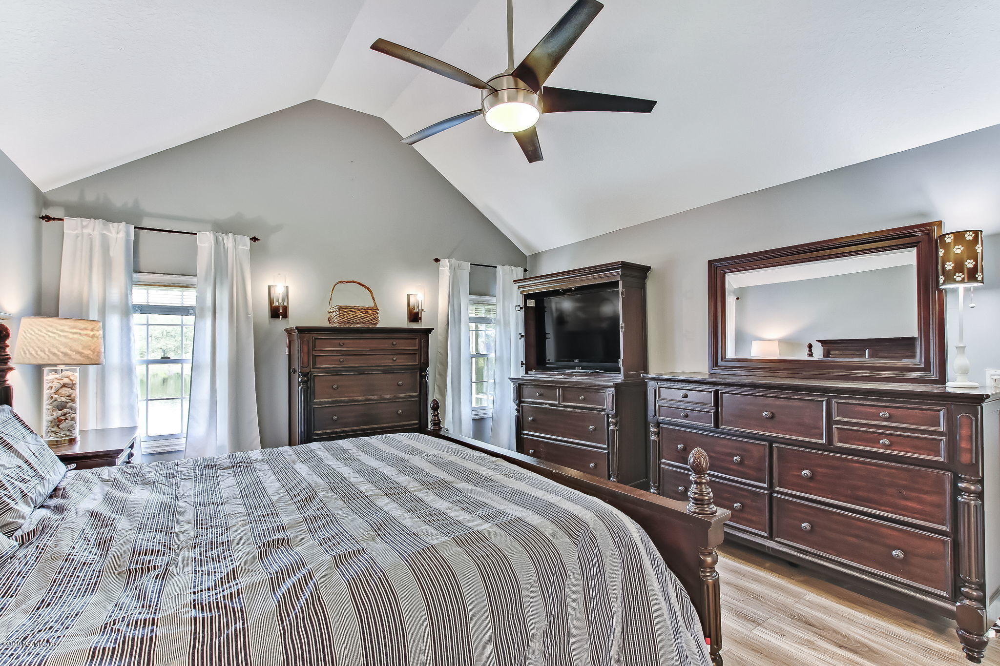 18261 Antler Road Hilliard, FL 32046 - Photo 5 of 32 a bedroom with a bed and a flat screen tv