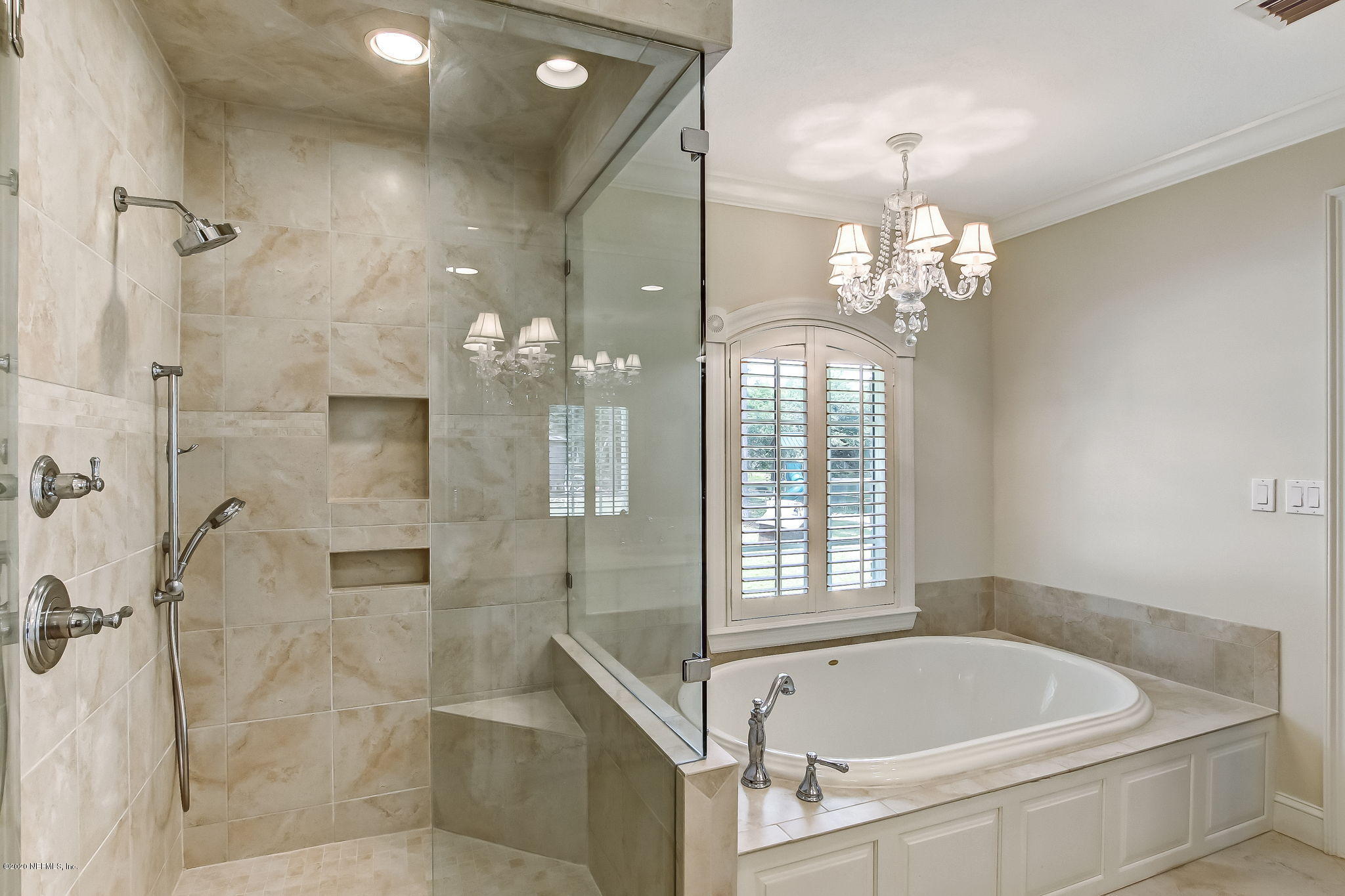 18261 Antler Road Hilliard, FL 32046 - Photo 6 of 32 a spacious bathroom with a bathtub and shower