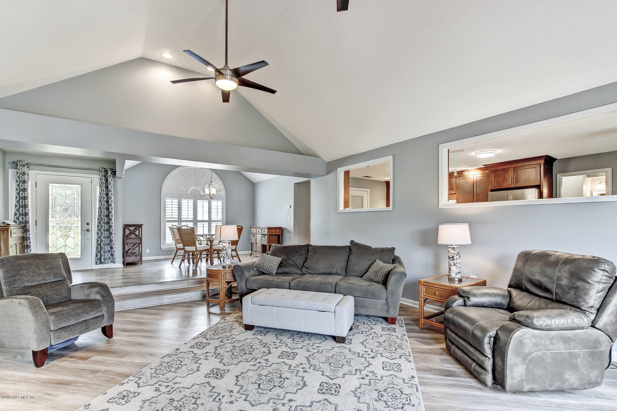 18261 Antler Road Hilliard, FL 32046 - Photo 10 of 32 a living room with furniture and a large window