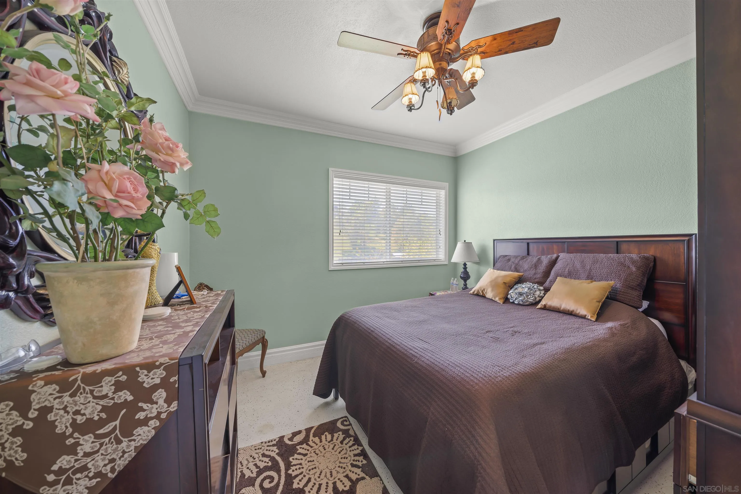 2464 Wynola Road Julian, CA 92036 - Photo 16 of 50 a bedroom with a bed and a potted plant
