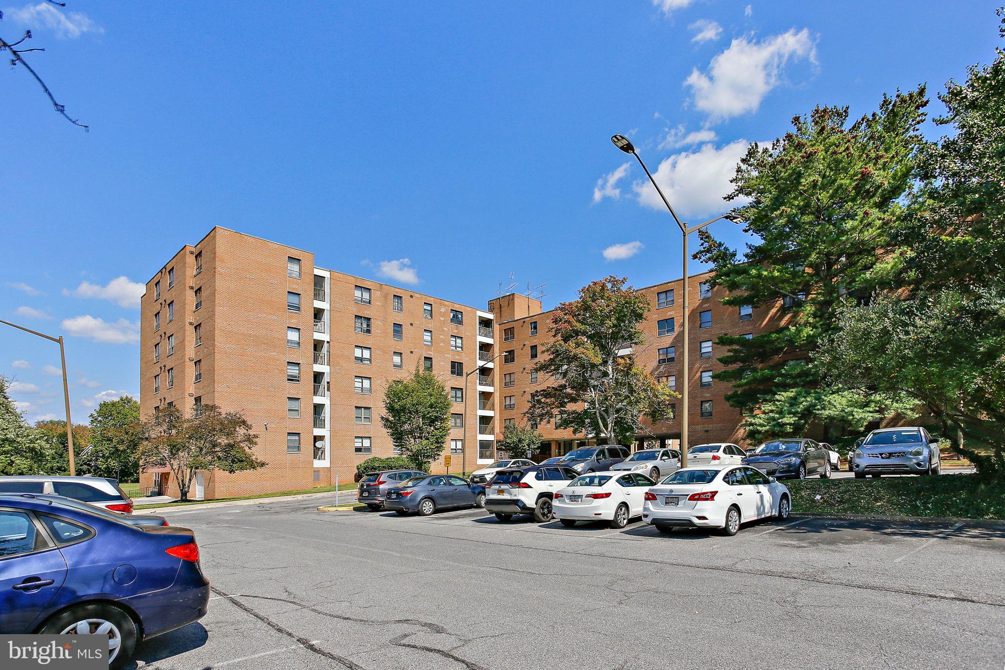 a view of car parked in front of a building