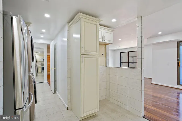 a bathroom with a glass shower door and a sink