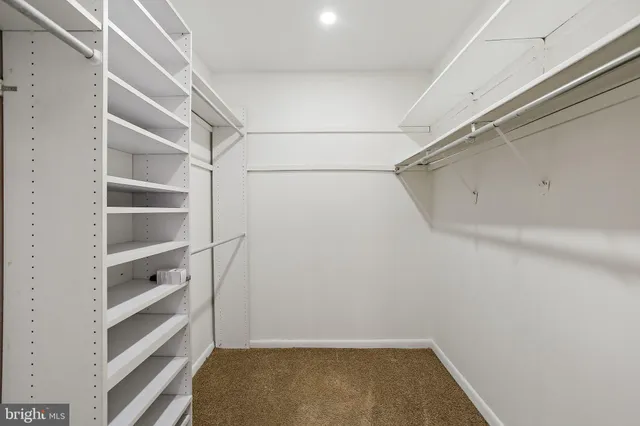 a view of an empty walk in closet