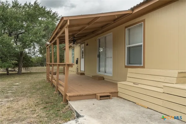 a view of backyard with cabin