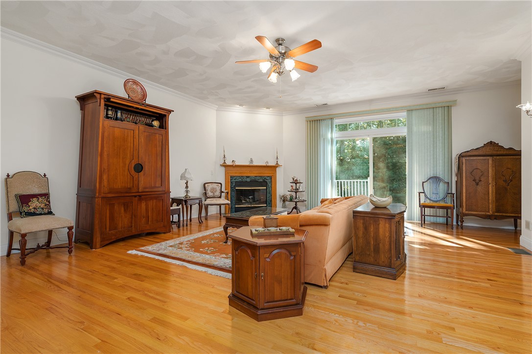 186 Old River Road, Unit 21 Lincoln, RI 02865 - Photo 21 of 34 gleaming hardwoods living room, 9' ceilings ceiling fan & light, gas fireplace with marble surround. Sliders to large private deck.