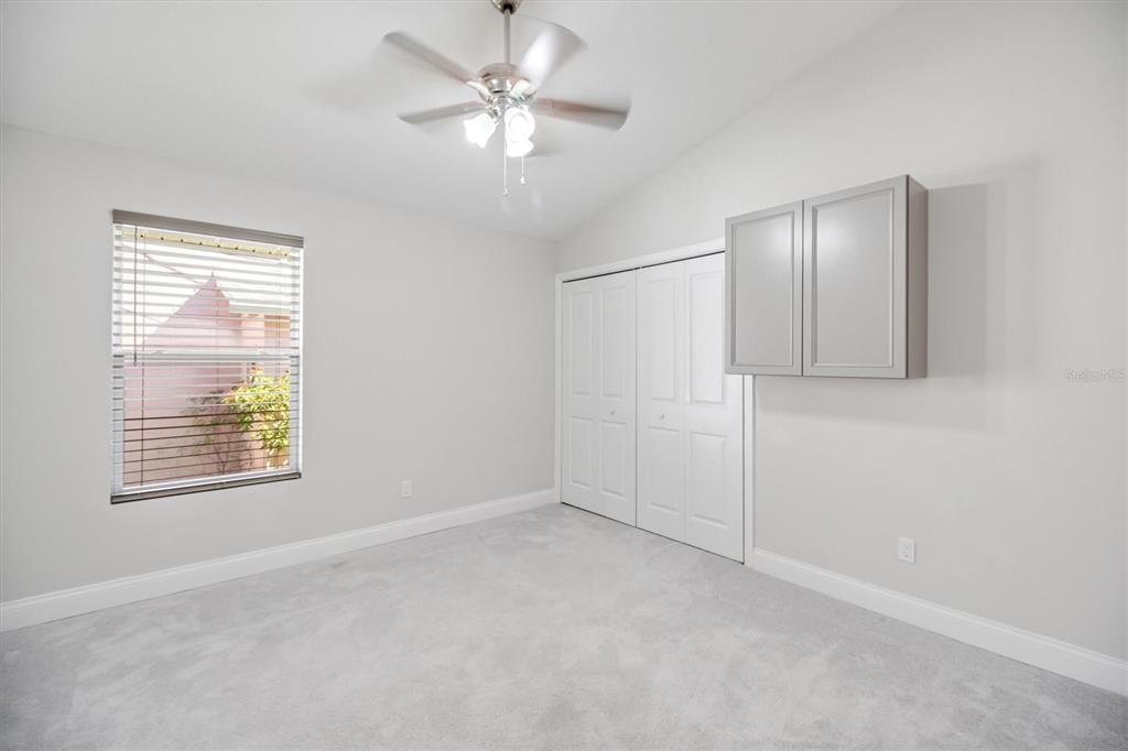 53 Wilmette Avenue Ormond Beach, FL 32174 - Photo 20 of 36 an empty room with windows and fan