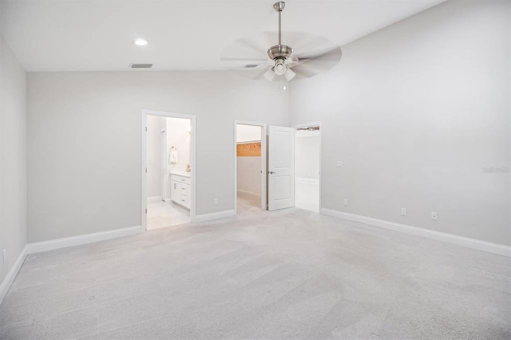 53 Wilmette Avenue Ormond Beach, FL 32174 - Photo 25 of 36 en empty room with fan and entrance