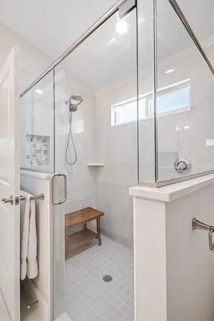 a bathroom with a shower and a sink