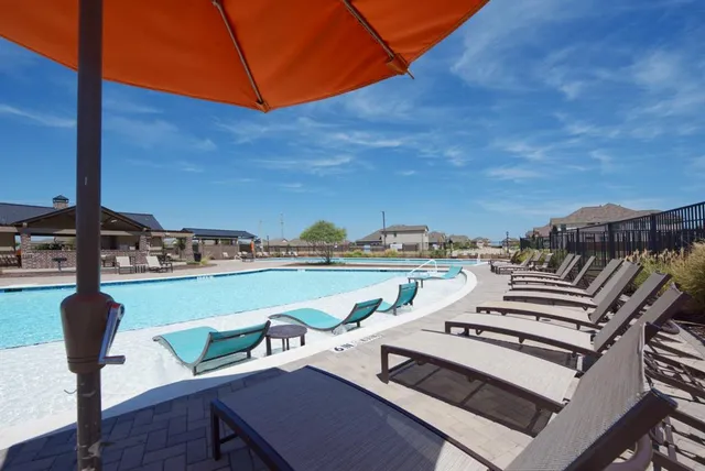 a view of a patio with swimming pool