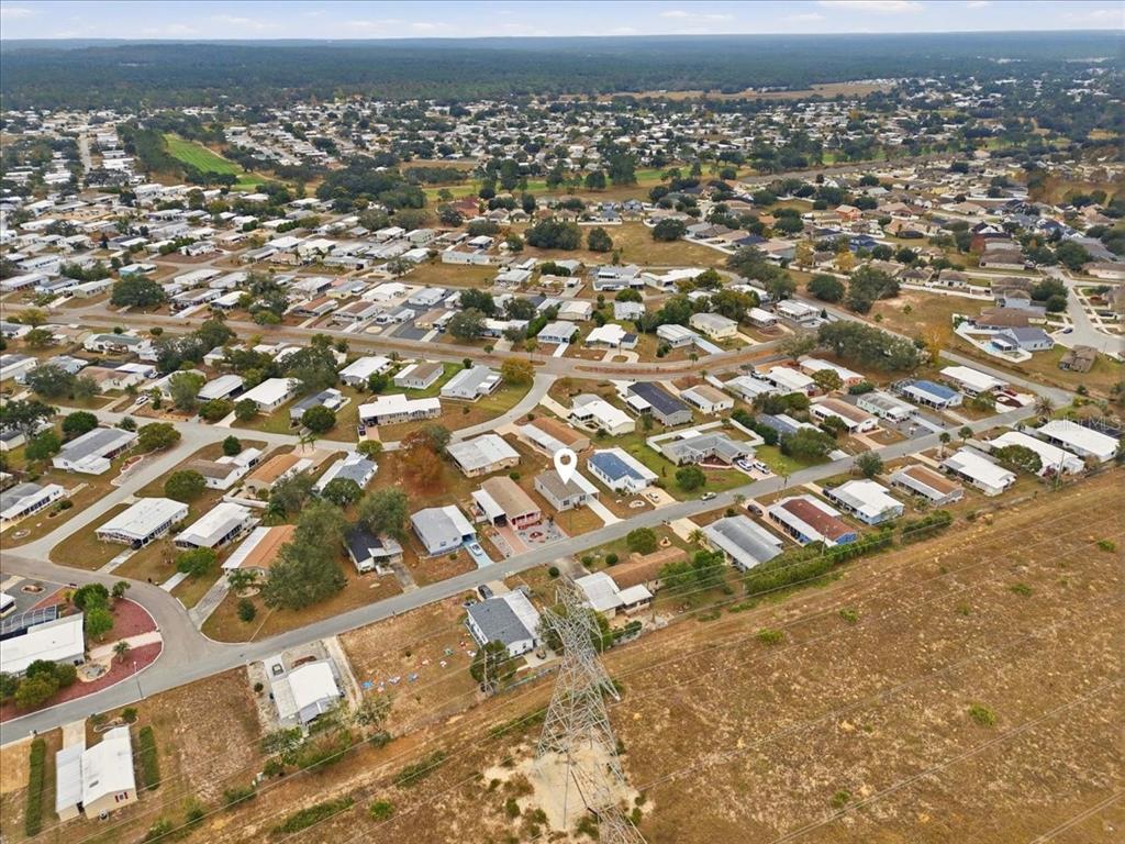9128 Scepter Avenue Brooksville, FL 34613 - Photo 11 of 44 an aerial view of residential houses with outdoor space