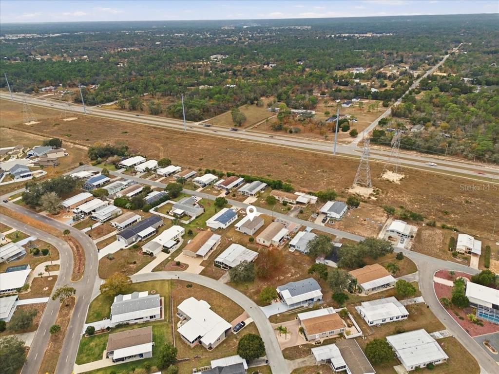 9128 Scepter Avenue Brooksville, FL 34613 - Photo 12 of 44 an aerial view of residential houses with city view