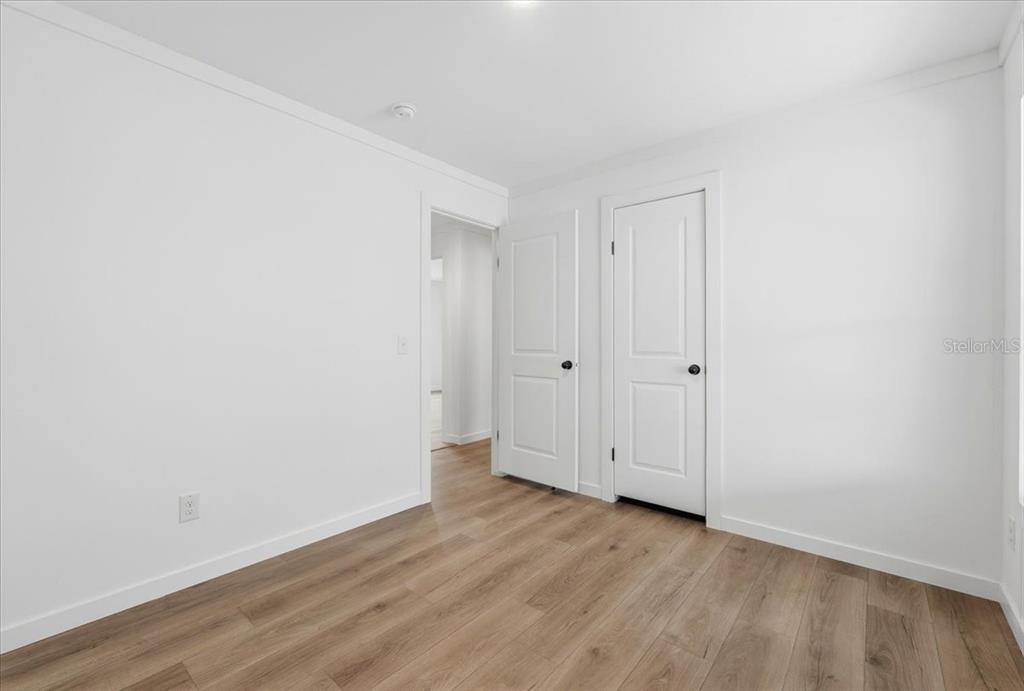 9128 Scepter Avenue Brooksville, FL 34613 - Photo 24 of 44 a view of room with hardwood floor