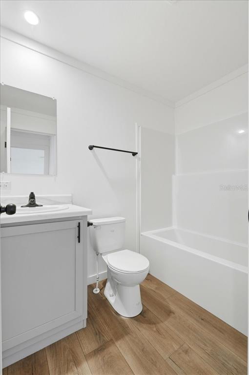 9128 Scepter Avenue Brooksville, FL 34613 - Photo 25 of 44 a bathroom with a sink a toilet and a bathtub