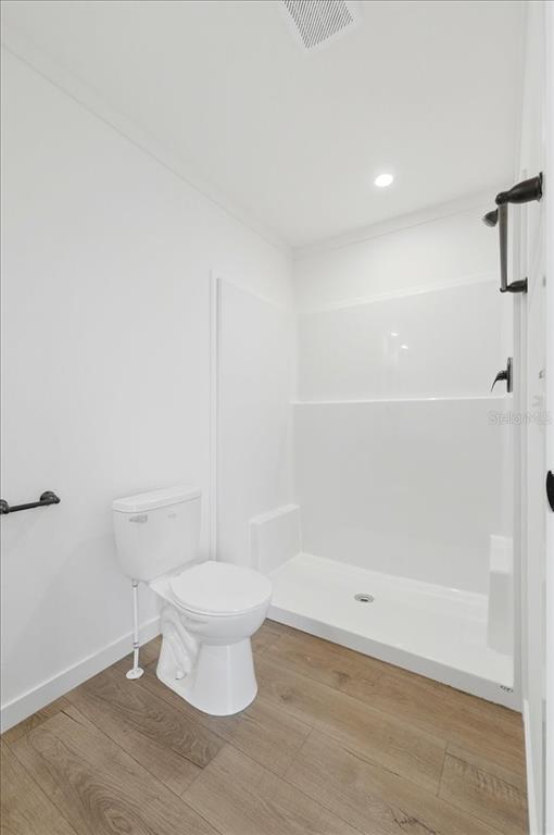 9128 Scepter Avenue Brooksville, FL 34613 - Photo 29 of 44 a bathroom with a toilet and a shower