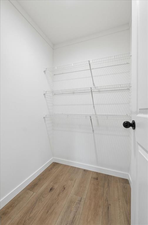 9128 Scepter Avenue Brooksville, FL 34613 - Photo 32 of 44 a view of a room with wooden floor