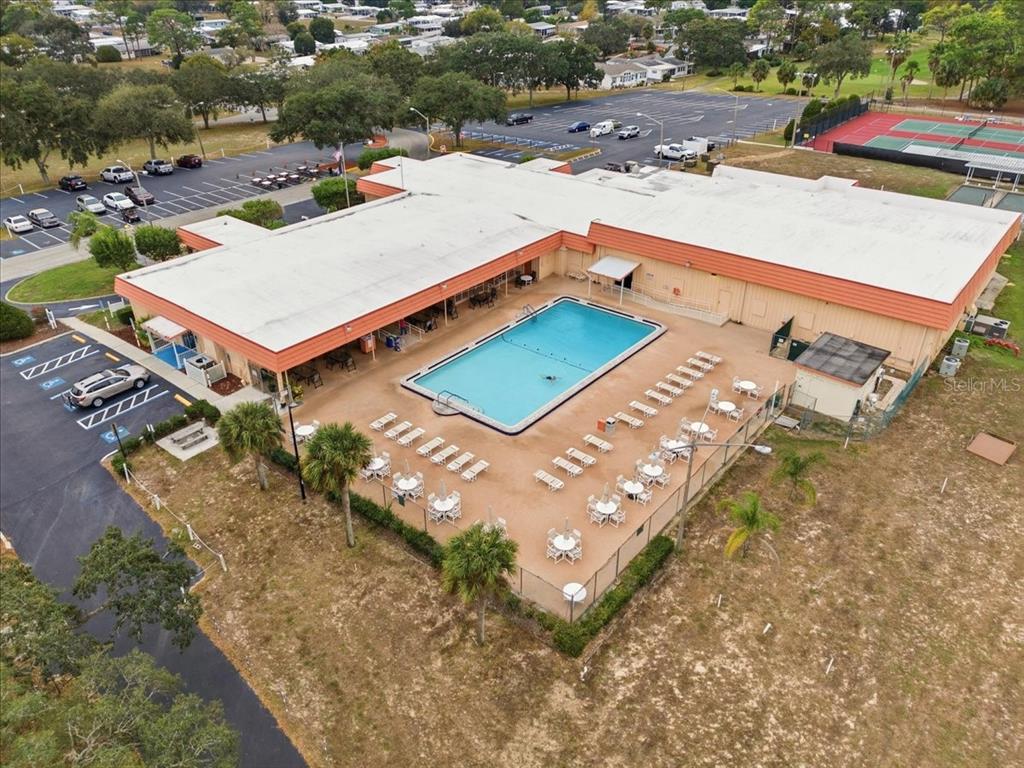9128 Scepter Avenue Brooksville, FL 34613 - Photo 41 of 44 an aerial view of a house with a swimming pool