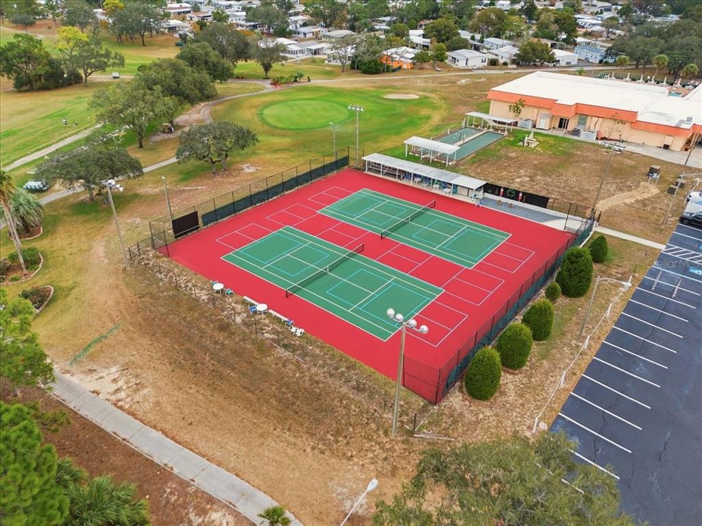 9128 Scepter Avenue Brooksville, FL 34613 - Photo 43 of 44 a view of a tennis ground with a large park