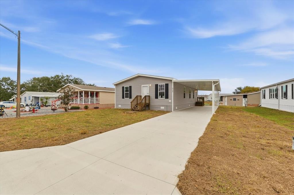 9128 Scepter Avenue Brooksville, FL 34613 - Photo 5 of 44 a front view of a house with swimming pool