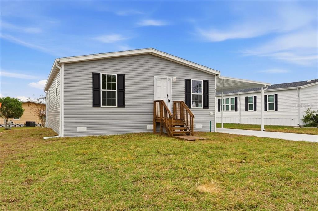 9128 Scepter Avenue Brooksville, FL 34613 - Photo 6 of 44 a view of a house with pool and sitting area