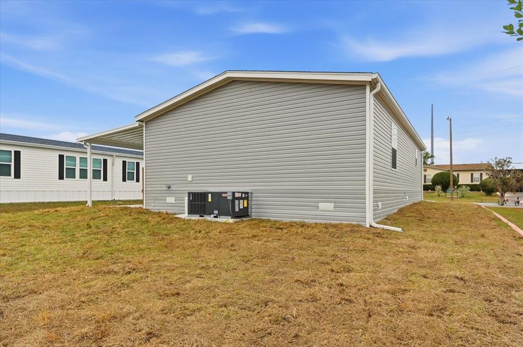 9128 Scepter Avenue Brooksville, FL 34613 - Photo 9 of 44 a view of a house with a yard