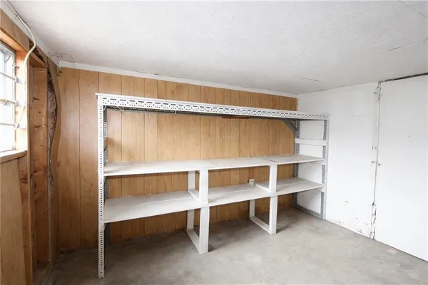 a living room with a furniture and a window