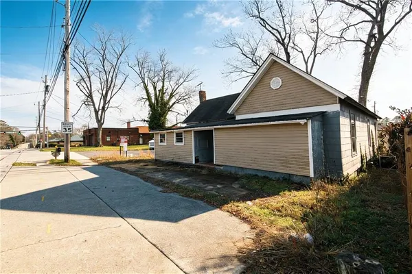 a front view of a house with yard